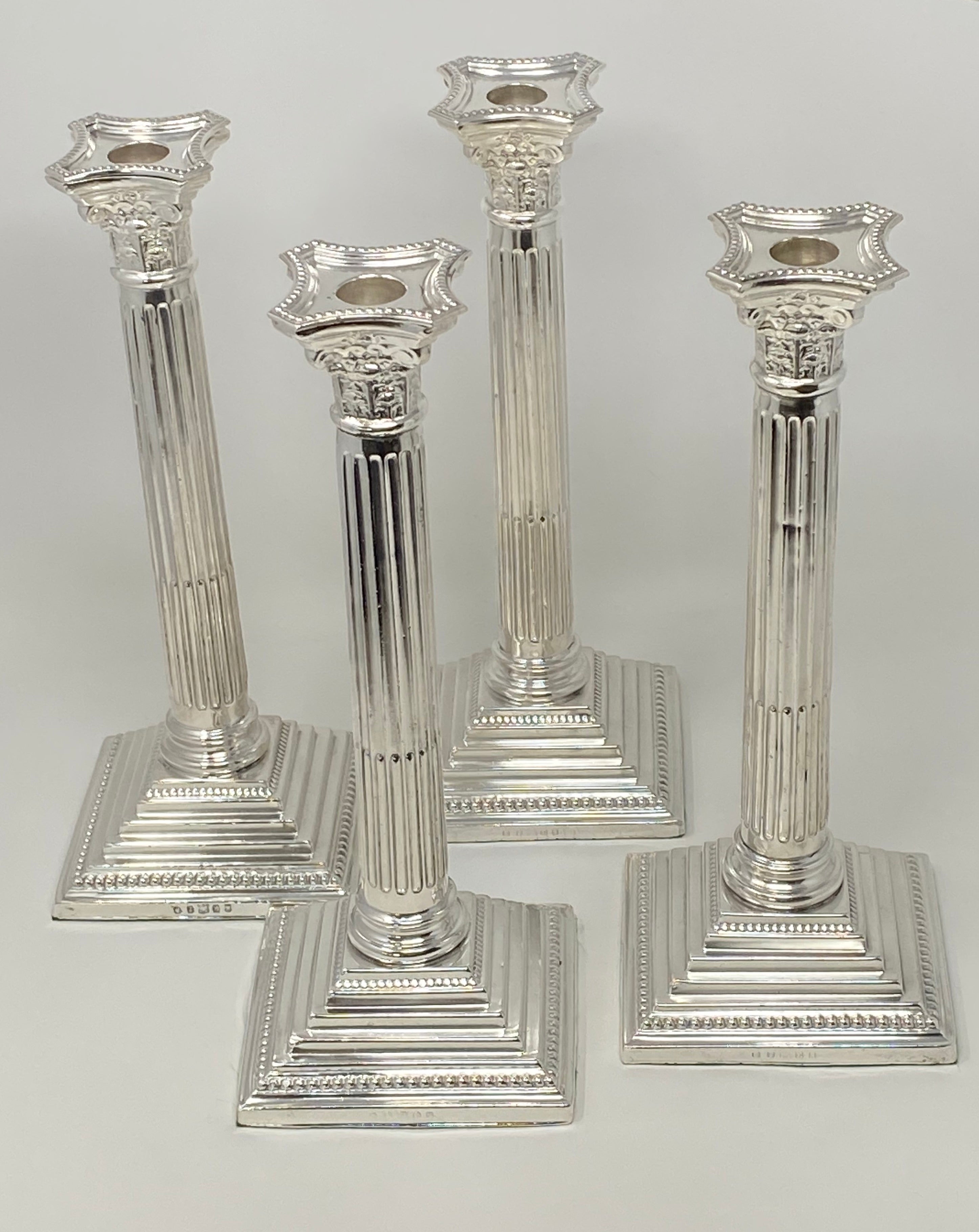 Set of 4 Silver Plated Corinthian Column Candlesticks